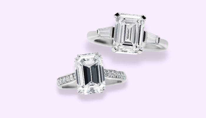 Diamond Engagement ring with emerald cut centre diamond and tapered baguettes with a platinum band, and a diamond engagement ring with an emerald cut centre stone and round brilliant diamond shoulders.