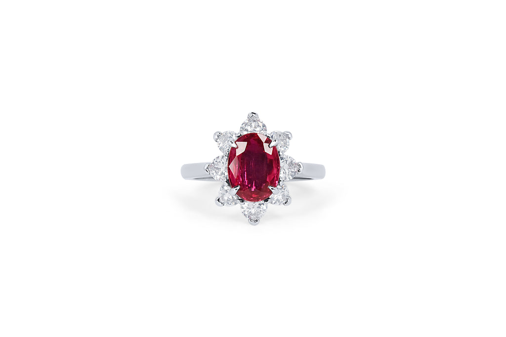 Bespoke oval ruby and diamond engagement ring