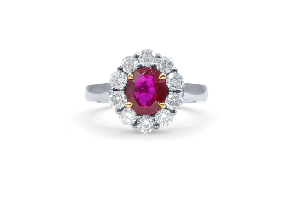 custom made halo style oval ruby and round diamond engagement ring