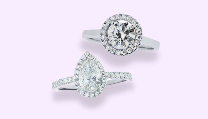 Diamond halo pear shaped engagement ring with diamond shoulders and a halo round brilliant diamond engagement ring with a platinum band.